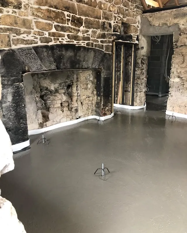The farmhouse interior during renovation, structure exposed